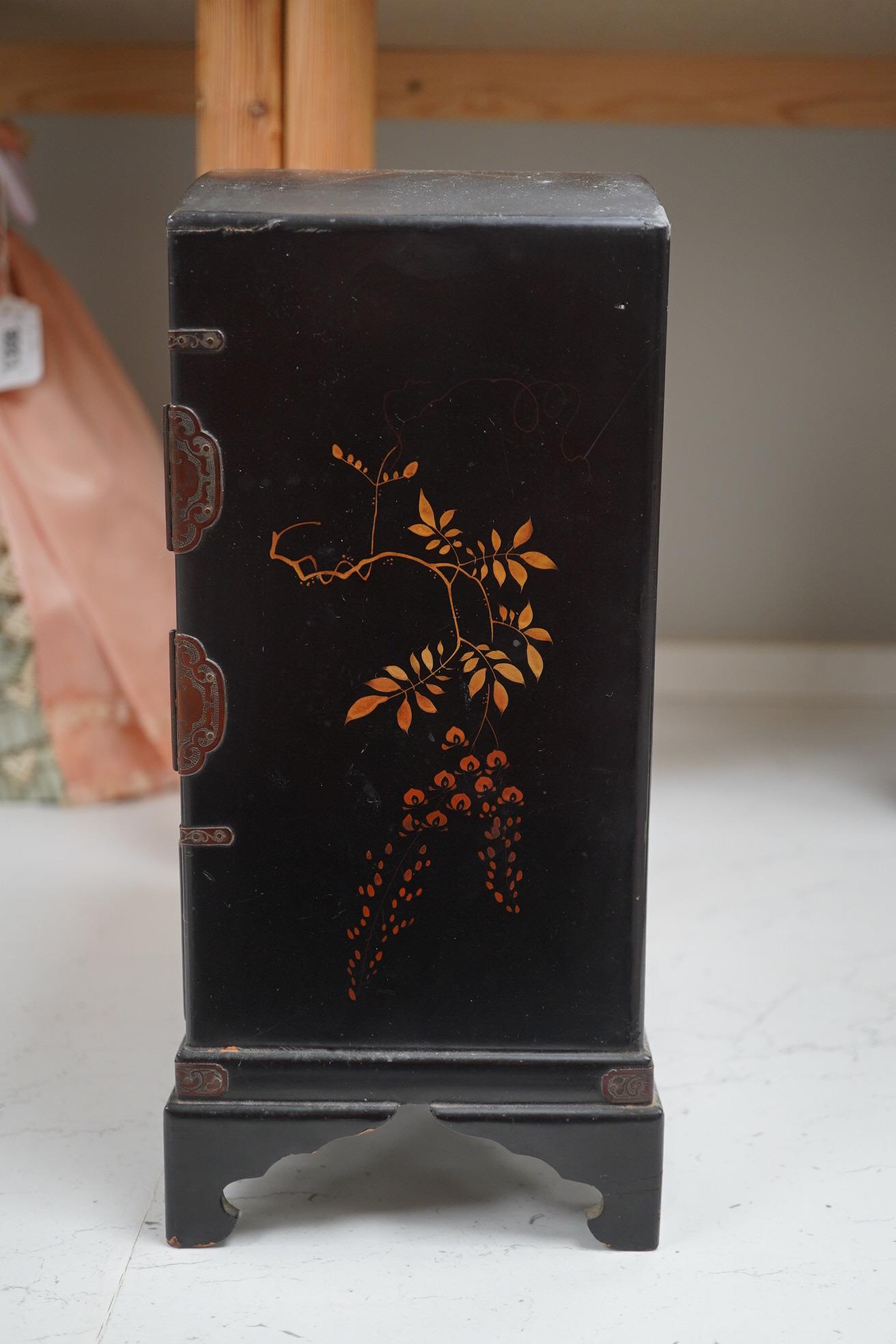 A late 19th early 20th century Japanese lacquer cabinet, 31cm high. Condition - exterior chipped and cracked near the top edge